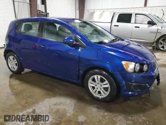 2012 Chevrolet Sonic LS with VIN 1G1JB6SH1C4191521, listed as a Copart auction lot 71214214 with 83,910 mi miles and Salvage title. Bid and sale history available at DreamBid. Image 4.