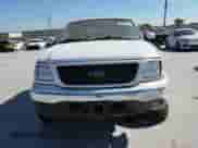 2003 Ford F-150 XL z VIN 2FTRX17L63CB07124, wystawiony jako Copart lot #86682935 z przebiegiem 101 788 mil mil oraz Szkoda całkowita • Salvage title. Historia ofert i sprzedaży dostępna na DreamBid. Obrazek 14.