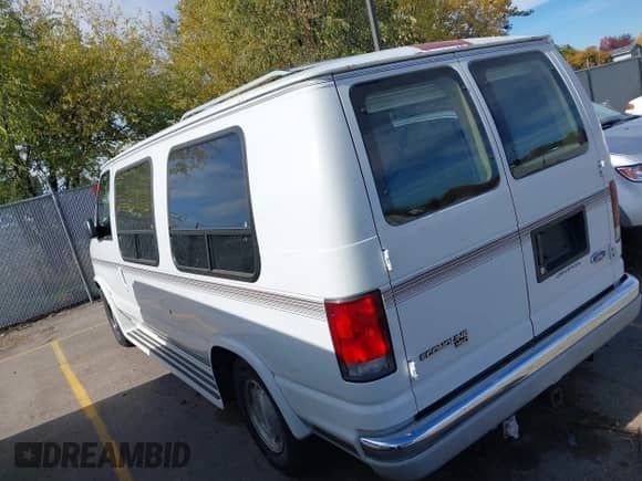 1996 Ford Econoline Cargo with VIN 1FDEE14HXTHB41088, listed as a IAAI auction lot 43460680 with 197,209 mi miles and . Bid and sale history available at DreamBid. Image 3.