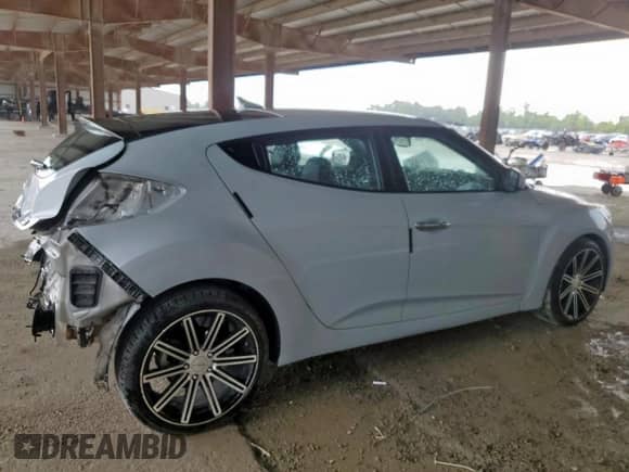 2014 Hyundai Veloster z VIN KMHTC6AD3EU214209, wystawiony jako Copart lot #69948355 z przebiegiem 144 925 mil mil oraz Szkoda całkowita • Salvage title. Historia ofert i sprzedaży dostępna na DreamBid. Obrazek 3.