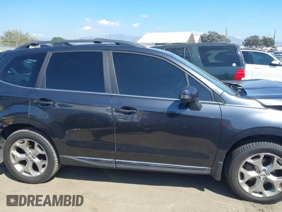 2018 Subaru Forester Touring with VIN JF2SJAWC7JH486100, listed as a IAAI auction lot 43311569 with 90,905 mi miles and . Bid and sale history available at DreamBid. Image 13.