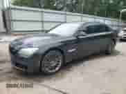 2013 BMW 7 Series 750i xDrive with VIN WBAYB6C57DD223543, listed as a Copart auction lot 59290365 with 116,576 mi miles and Salvage title. Bid and sale history available at DreamBid. Image 1.