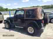 1999 Jeep Wrangler Sahara с VIN 1J4FY49S6XP432277, выставлен на аукционе Copart как лот 61622585 с пробегом 113 390 миль миль и Списание • Salvage title. История ставок и продаж доступна на DreamBid. Изображение 2.