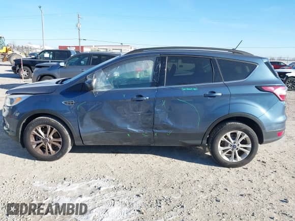 2018 Ford Escape SE with VIN 1FMCU9GD2JUA21484, listed as a IAAI auction lot 41285765 with 102,523 mi miles and . Bid and sale history available at DreamBid. Image 14.