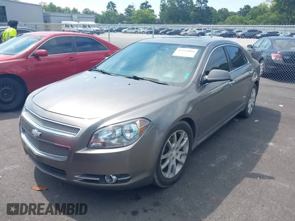 2012 Chevrolet Malibu LTZ z VIN 1G1ZG5E77CF164975, wystawiony jako IAAI lot #42513864 z przebiegiem 195 299 mil mil oraz . Historia ofert i sprzedaży dostępna na DreamBid. Obrazek 2.