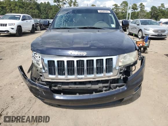 2011 Jeep Grand Cherokee Laredo with VIN 1J4RS4GG0BC658098, listed as a Copart auction lot 84580365 with 212,377 mi miles and Salvage title. Bid and sale history available at DreamBid. Image 5.