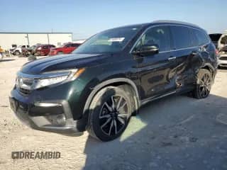 2020 Honda Pilot Touring 7-Passenger z VIN 5FNYF5H64LB006736, wystawiony jako Copart lot #87458574 z przebiegiem 63 534 mil mil oraz Szkoda całkowita • Salvage title. Historia ofert i sprzedaży dostępna na DreamBid. Obrazek 1.