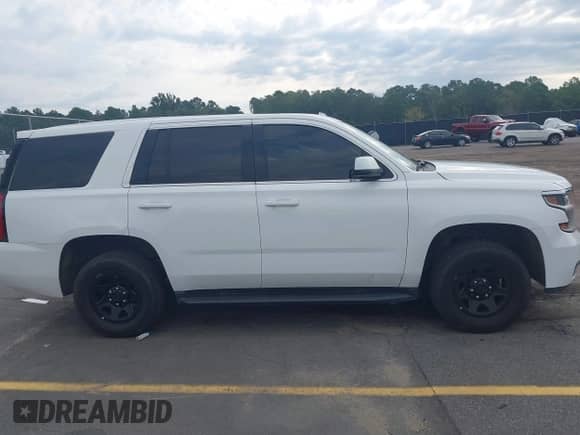 2018 Chevrolet Tahoe Commercial with VIN 1GNLCDEC4JR223676, listed as a IAAI auction lot 43107800 with 208,566 mi miles and . Bid and sale history available at DreamBid. Image 13.