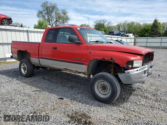 2000 Dodge 2500 with VIN 1B7KF23Z6YJ187490, listed as a Copart auction lot 57873375 with 238,769 mi miles and Salvage title. Bid and sale history available at DreamBid. Image 4.