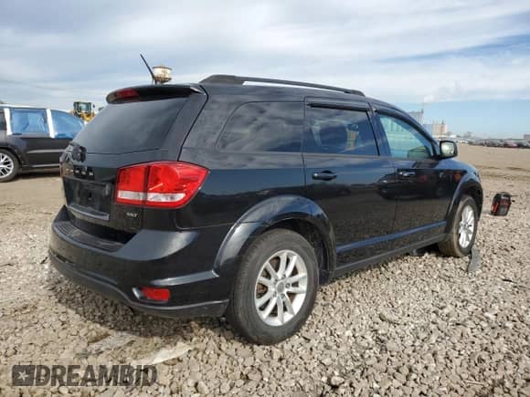 2013 Dodge Journey SXT with VIN 3C4PDCBB1DT722833, listed as a Copart auction lot 70559015 with 198,104 mi miles and Salvage title. Bid and sale history available at DreamBid. Image 3.