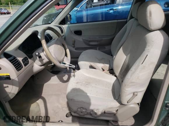 2005 Hyundai Accent GLS с VIN KMHCG35C05U325871, выставлен на аукционе Copart как лот 64258985 с пробегом 166 574 миль миль и Списание • Salvage title. История ставок и продаж доступна на DreamBid. Изображение 7.