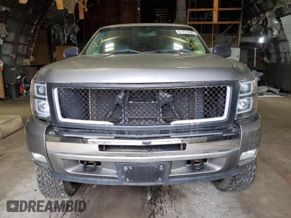 2013 Chevrolet Silverado 1500 LTZ z VIN 3GCPKTE77DG278332, wystawiony jako Copart lot #61771285 z przebiegiem 196 743 mil mil oraz Szkoda całkowita • Salvage title. Historia ofert i sprzedaży dostępna na DreamBid. Obrazek 5.