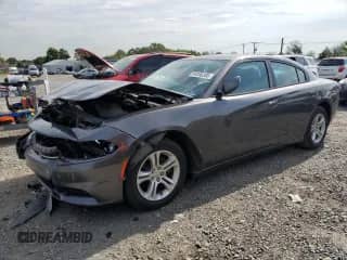 2015 Dodge Charger SE with VIN 2C3CDXBG6FH847974, listed as a Copart auction lot 84206385 with 107,282 mi miles and Salvage title. Bid and sale history available at DreamBid. Image 1.
