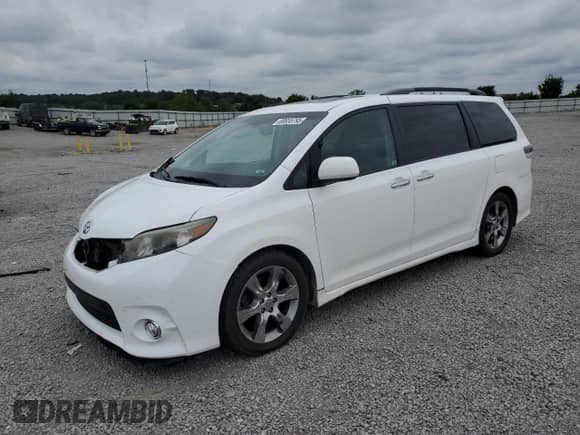 2014 Toyota Sienna SE with VIN 5TDXK3DCXES431576, listed as a Copart auction lot 69655795 with 221,877 mi miles and Salvage title. Bid and sale history available at DreamBid. Image 1.