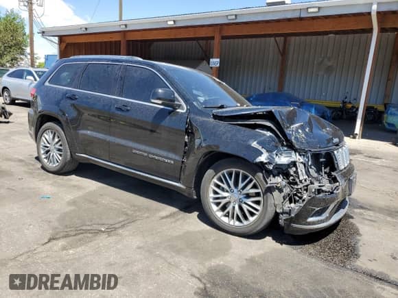 2018 Jeep Grand Cherokee Summit with VIN 1C4RJFJT6JC258846, listed as a Copart auction lot 57971185 with 114,587 mi miles and Salvage title. Bid and sale history available at DreamBid. Image 4.
