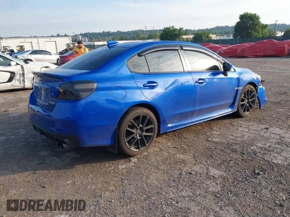 2021 Subaru WRX Premium with VIN JF1VA1C69M9816477, listed as a IAAI auction lot 42616995 with 54,668 mi miles and . Bid and sale history available at DreamBid. Image 4.