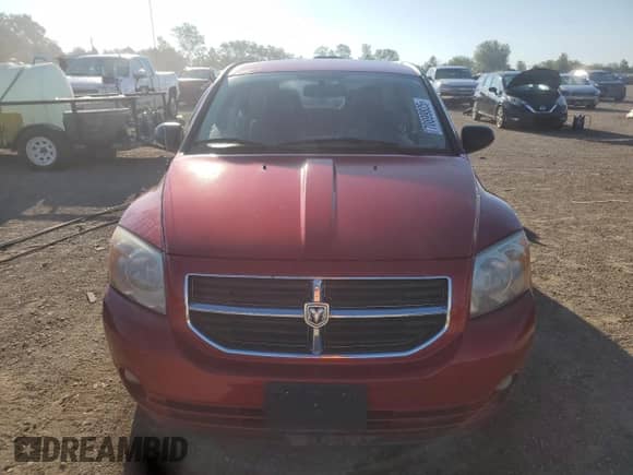 2007 Dodge Caliber SXT with VIN 1B3JB48B87D504439, listed as a Copart auction lot 70899825 with 134,683 mi miles and Salvage title. Bid and sale history available at DreamBid. Image 5.