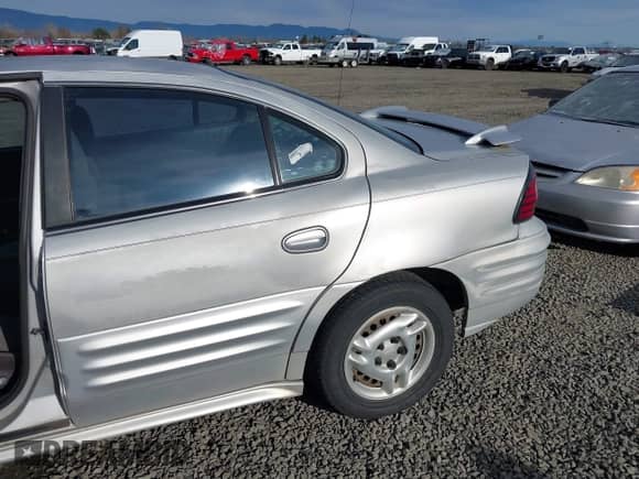 2001 Pontiac Grand Am SE1 with VIN 1G2NF52TX1M560650, listed as a IAAI auction lot 41654339 with 122,885 mi miles and . Bid and sale history available at DreamBid. Image 6.