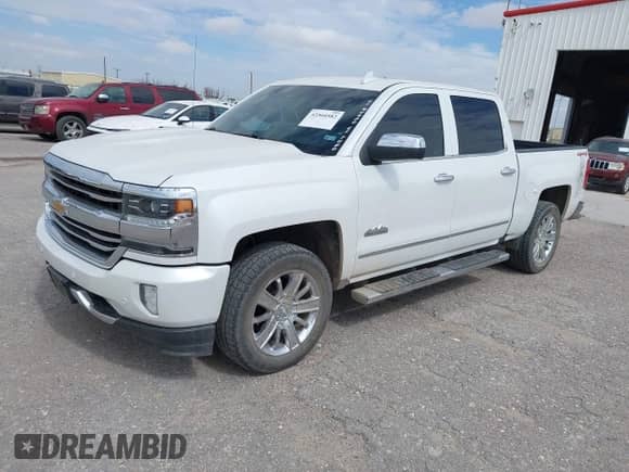 2017 Chevrolet Silverado 1500 High Country z VIN 3GCUKTECXHG309062, wystawiony jako IAAI lot #42560582 z przebiegiem 135 060 mil mil oraz . Historia ofert i sprzedaży dostępna na DreamBid. Obrazek 17.