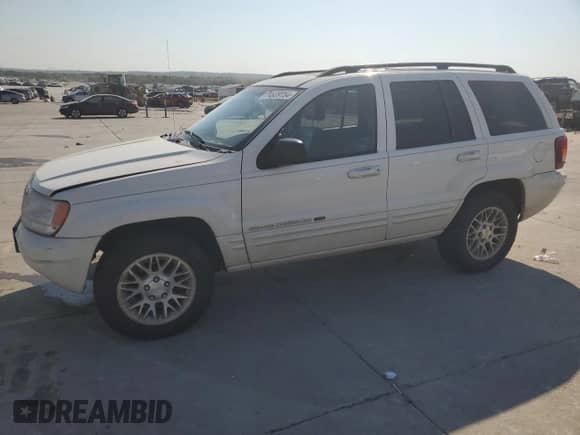 2002 Jeep Grand Cherokee Limited with VIN 1J4GX58N12C282300, listed as a Copart auction lot 74939754 with 166,018 mi miles and Salvage title. Bid and sale history available at DreamBid. Image 1.