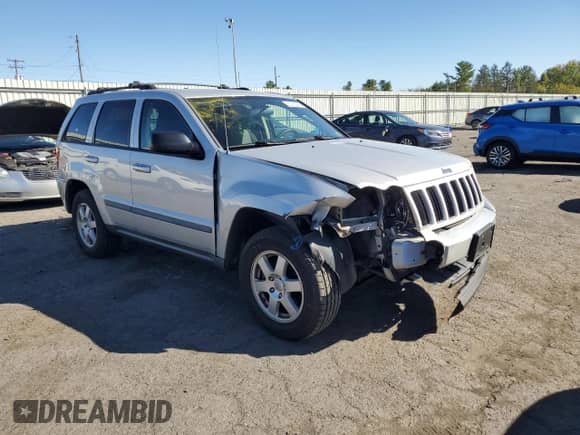 2009 Jeep Grand Cherokee Laredo with VIN 1J8GR48K69C530219, listed as a Copart auction lot 82320295 with 231,364 mi miles and Salvage title. Bid and sale history available at DreamBid. Image 4.