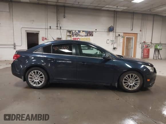 2014 Chevrolet Cruze ECO z VIN 1G1PH5SB5E7393200, wystawiony jako IAAI lot #42578302 z przebiegiem 160 001 mil mil oraz . Historia ofert i sprzedaży dostępna na DreamBid. Obrazek 13.