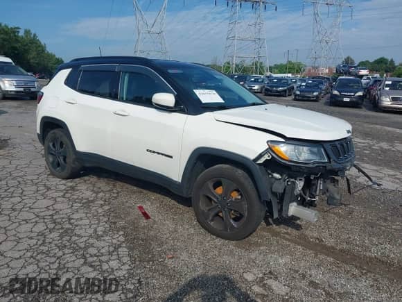 2019 Jeep Compass Latitude with VIN 3C4NJDBB2KT776516, listed as a IAAI auction lot 42635670 with 96,827 mi miles and . Bid and sale history available at DreamBid. Image 1.