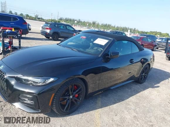 2022 BMW 4 Series 430i with VIN WBA23AT06NCJ10779, listed as a IAAI auction lot 42000961 with 49,634 mi miles and . Bid and sale history available at DreamBid. Image 13.