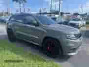 2021 Jeep Grand Cherokee SRT with VIN 1C4RJFDJ0MC537479, listed as a Copart auction lot 57411135 with 53,453 mi miles and Salvage title. Bid and sale history available at DreamBid. Image 1.