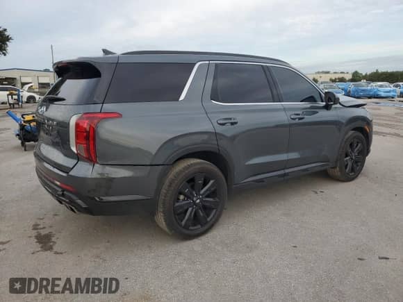 2024 Hyundai Palisade XRT z VIN KM8R34GE7RU725068, wystawiony jako Copart lot #81010855 z przebiegiem 50 987 mil mil oraz Nie do naprawy • Non repairable. Historia ofert i sprzedaży dostępna na DreamBid. Obrazek 3.