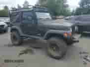 2003 Jeep Wrangler Rubicon с VIN 1J4FA69S93P334595, выставлен на аукционе Copart как лот 68247145 с пробегом 127 361 миль миль и Списание • Salvage title. История ставок и продаж доступна на DreamBid. Изображение 4.