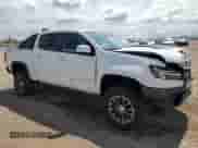 2018 Chevrolet Colorado 4WD ZR2 with VIN 1GCGTEENXJ1147560, listed as a Copart auction lot 67900245 with 93,318 mi miles and Salvage title. Bid and sale history available at DreamBid. Image 4.