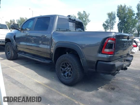 2022 Ram 1500 TRX with VIN 1C6SRFU91NN392885, listed as a IAAI auction lot 42482710 with 13,090 mi miles and . Bid and sale history available at DreamBid. Image 3.