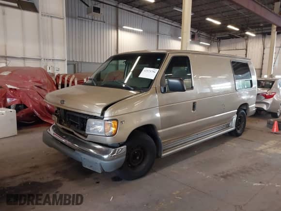 1999 Ford Econoline Cargo with VIN 1FDRE14W5XHA87026, listed as a IAAI auction lot 42573756 with 93,360 mi miles and . Bid and sale history available at DreamBid. Image 2.