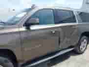 2016 Chevrolet Suburban LT with VIN 1GNSKHKC9GR275615, listed as a IAAI auction lot 42296718 with 91,853 mi miles and . Bid and sale history available at DreamBid. Image 6.
