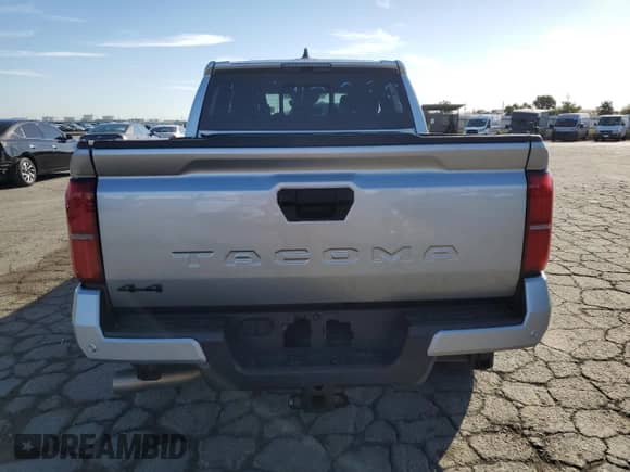 2024 Toyota Tacoma TRD Off Road with VIN 3TMLB5JN8RM000837, listed as a Copart auction lot 82183745 with 14,184 mi miles and Salvage title. Bid and sale history available at DreamBid. Image 6.