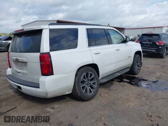 2017 Chevrolet Tahoe LS with VIN 1GNSCAKC5HR312729, listed as a IAAI auction lot 41928484 with 206,999 mi miles and . Bid and sale history available at DreamBid. Image 4.