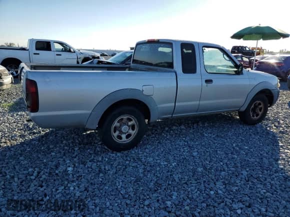 2003 Nissan Frontier XE with VIN 1N6DD26T03C402877, listed as a Copart auction lot 82664645 with 225,822 mi miles and Clean title. Bid and sale history available at DreamBid. Image 3.