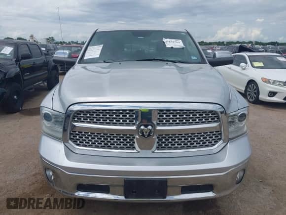 2014 Ram 1500 Laramie with VIN 1C6RR6NT0ES122640, listed as a IAAI auction lot 42638561 with 129,878 mi miles and . Bid and sale history available at DreamBid. Image 12.