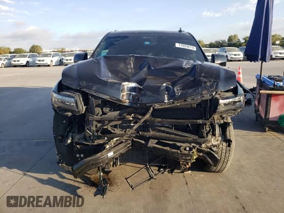 2024 Cadillac Escalade with VIN 1GYS4PKT3RR207675, listed as a Copart auction lot 77889674 with 34,951 mi miles and Salvage title. Bid and sale history available at DreamBid. Image 5.