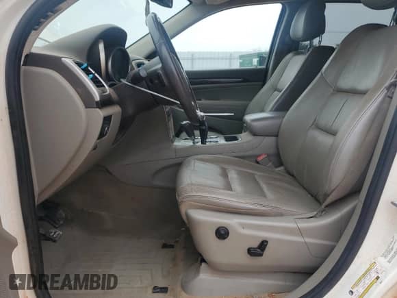 2012 Jeep Grand Cherokee Laredo z VIN 1C4RJEAG3CC251515, wystawiony jako Copart lot #83939905 z przebiegiem 131 869 mil mil oraz Szkoda całkowita • Salvage title. Historia ofert i sprzedaży dostępna na DreamBid. Obrazek 7.