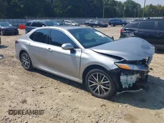 2023 Toyota Camry Hybrid XLE with VIN 4T1F31AK2PU612612, listed as a IAAI auction lot 43246178 with 25,221 mi miles and . Bid and sale history available at DreamBid. Image 1.