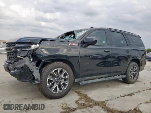 2023 Chevrolet Tahoe Z71 z VIN 1GNSKPKD5PR174767, wystawiony jako Copart lot #68348235 z przebiegiem 61 771 mil mil oraz Czysty tytuł • Clean title. Historia ofert i sprzedaży dostępna na DreamBid. Obrazek 1.