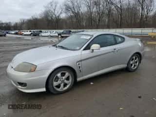 2006 Hyundai Tiburon GS с VIN KMHHM65D96U222152, выставлен на аукционе Copart как лот 85370164 с пробегом 58 892 миль миль и Чистый • Clean title. История ставок и продаж доступна на DreamBid. Изображение 1.