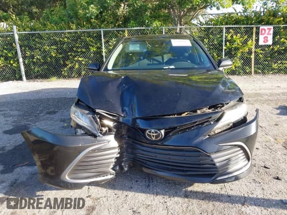2021 Toyota Camry LE with VIN 4T1C11AK2MU472694, listed as a IAAI auction lot 43340745 with 61,965 mi miles and . Bid and sale history available at DreamBid. Image 12.