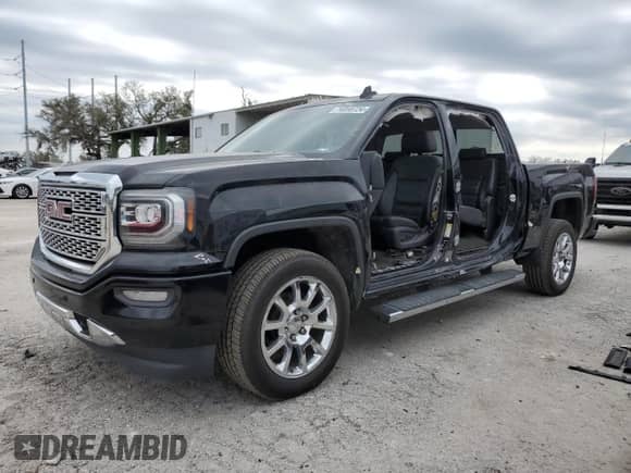 2017 GMC Sierra 1500 Denali with VIN 3GTP1PEC7HG487096, listed as a Copart auction lot 74059724 with 105,667 mi miles and Salvage title. Bid and sale history available at DreamBid. Image 1.