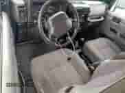 1999 Jeep Wrangler Sport with VIN 1J4FY19S7XP435204, listed as a Copart auction lot 83820835 with 263,738 mi miles and Clean title. Bid and sale history available at DreamBid. Image 8.