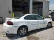2002 Pontiac Grand Am GT z VIN 1G2NW52E62M603951, wystawiony jako Copart lot #65606355 z przebiegiem 76 254 mil mil oraz Szkoda całkowita • Salvage title. Historia ofert i sprzedaży dostępna na DreamBid. Obrazek 3.