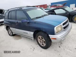 2002 Chevrolet Tracker LT z VIN 2CNBE634126928532, wystawiony jako Copart lot #76990704 z przebiegiem Nie podano mil oraz Szkoda całkowita • Salvage title. Historia ofert i sprzedaży dostępna na DreamBid. Obrazek 4.