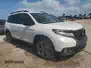 2021 Honda Passport Touring with VIN 5FNYF7H93MB014916, listed as a Copart auction lot 75050454 with 28,364 mi miles and Non repairable. Bid and sale history available at DreamBid. Image 4.